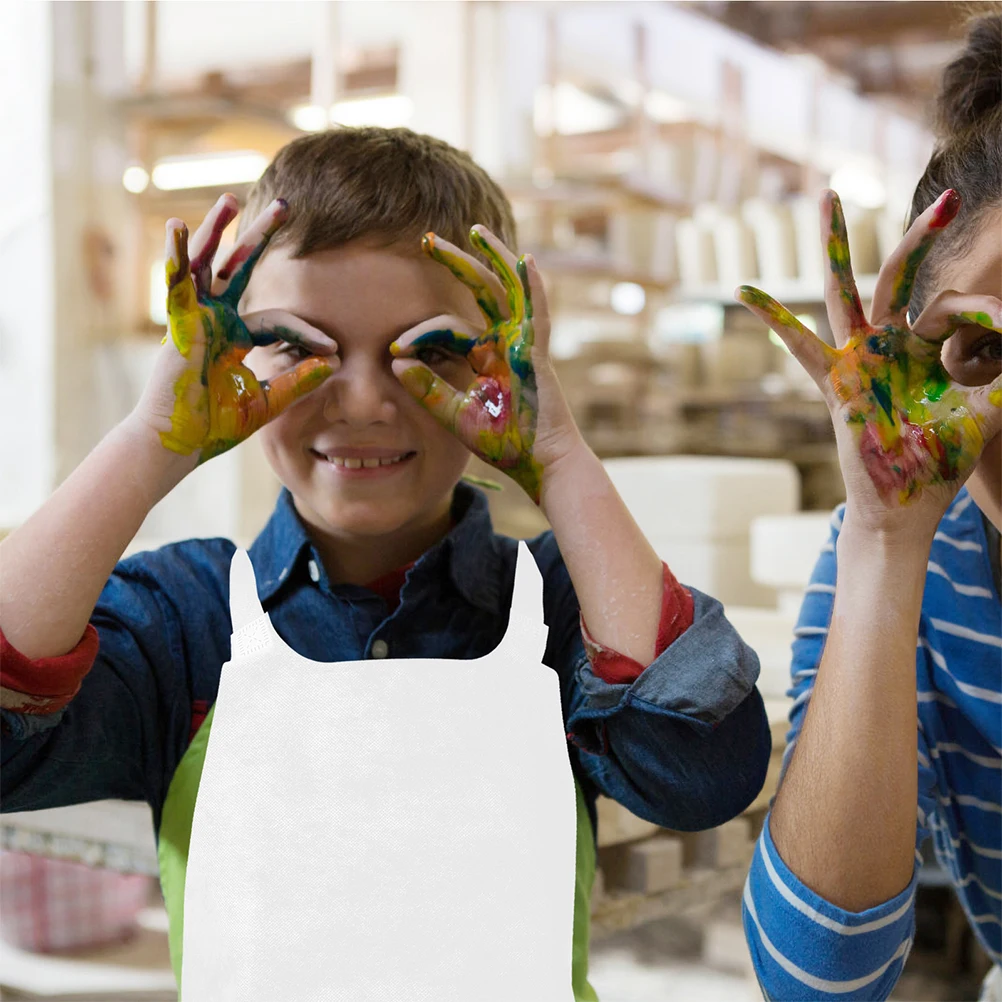 

20Pcs Childrens Nonwoven Aprons for Art and Cooking DIY Craft Easy to Clean White Adjustable Shoulder Straps Server Work Aprons