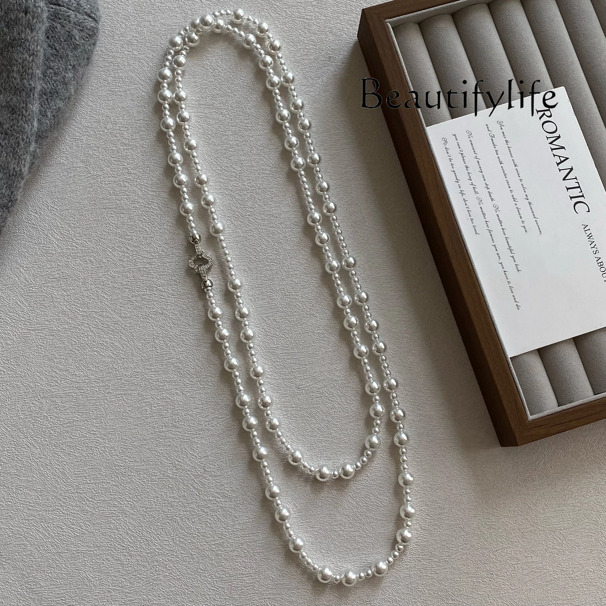 Double-layer autumn and winter four-leaf clover pearl sweater chain long light luxury high-end sweater necklace women