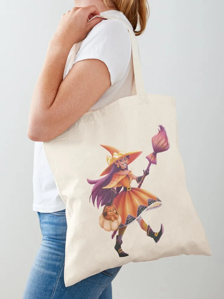

Witch with her magic broom and her orange cat in a pumpkin Tote Bag Shopping bags Eco bag tote bag woman Lady