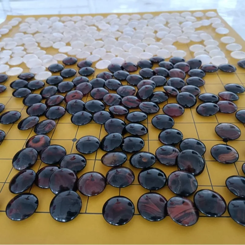 Black through red agate Go pieces plus ice, white agate Go pieces