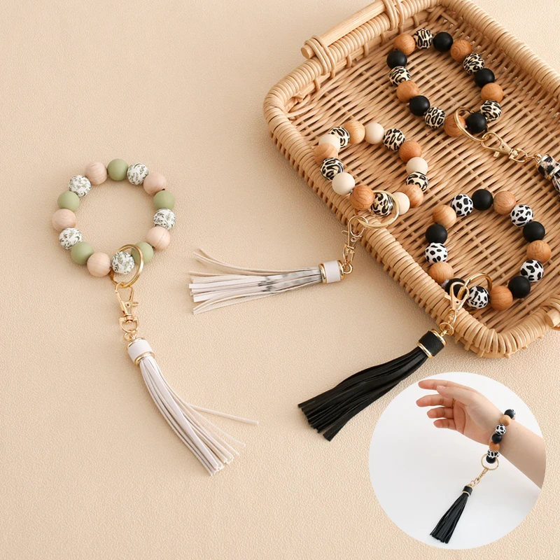 

Silicone Grindable Teether Bracelet Keychain Tassels Pendant Keyrings Wooden Anti-lost Women Keychains Baby Teether Keychain