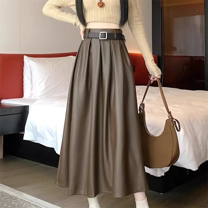 أسود فو بولي Leather جلد المرأة ألف خط التنانير 2026 جديد الخريف الشتاء عالية واسط الصلبة شيك مظلة مكتب التنانير الإناث #1