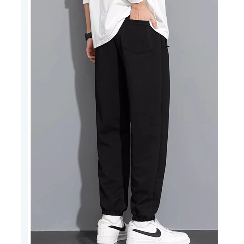 ฤดูใบไม้ผลิและฤดูหนาวกางเกงลําลองผู้ชายกางเกงกีฬาสีทึบหลวมพลัสไขมัน PLUS ขนาดแนวโน้มกางเกงขายาวทุกคู่