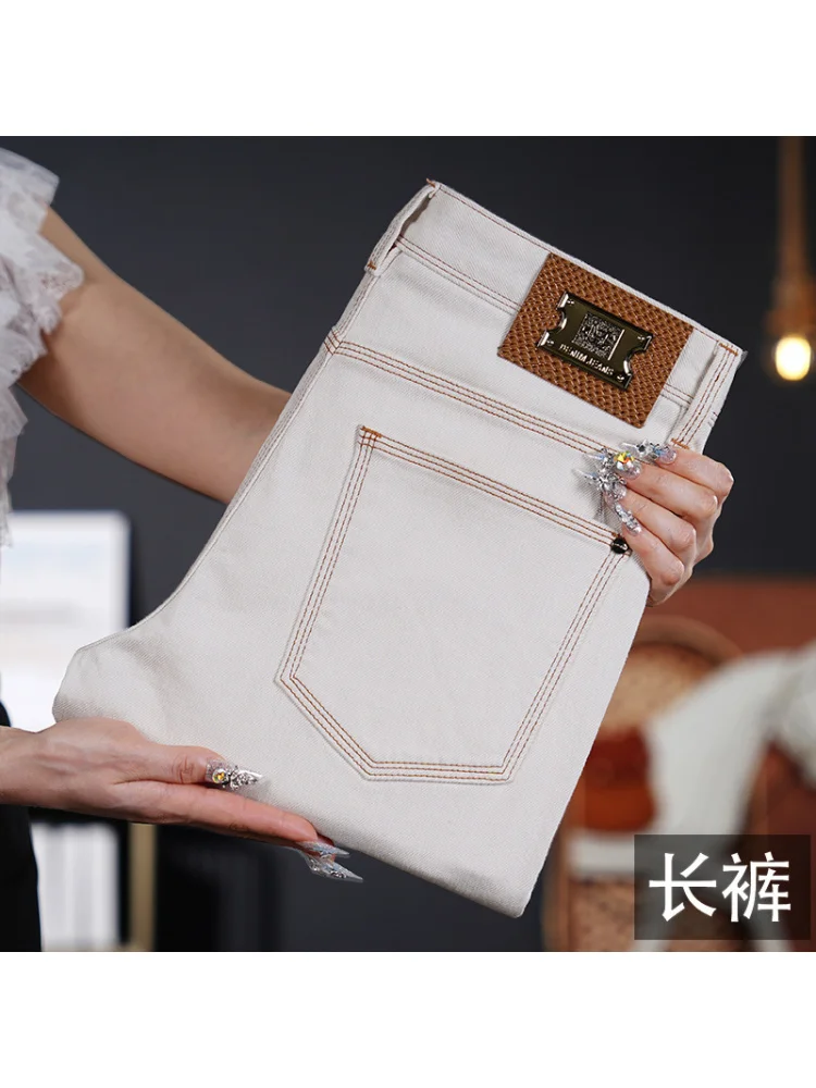 2025年ライトラグジュアリージーンズ メンズ ホワイト ファッション 春夏 薄手 カジュアル 伸縮性 スリム スモールフットパンツ