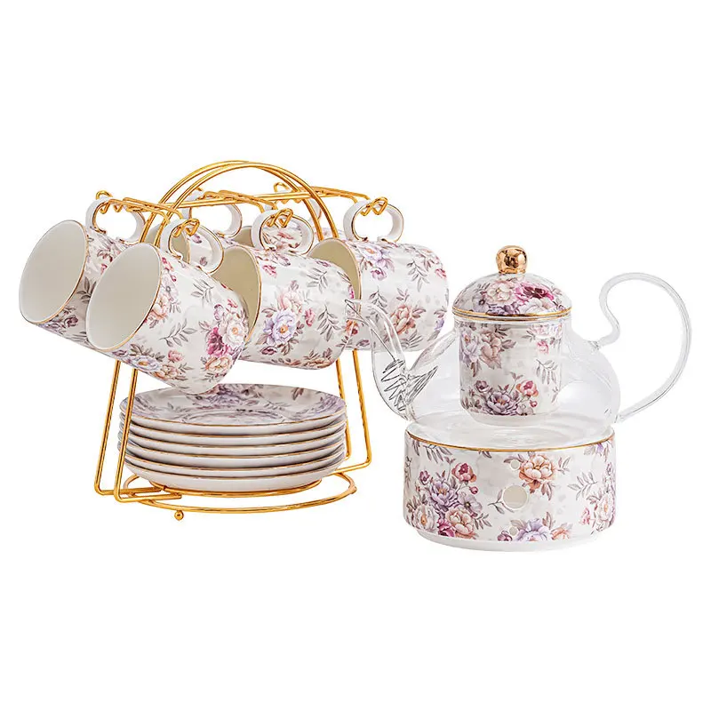 

glass flower tea cup set with heated ceramic base and infuser
