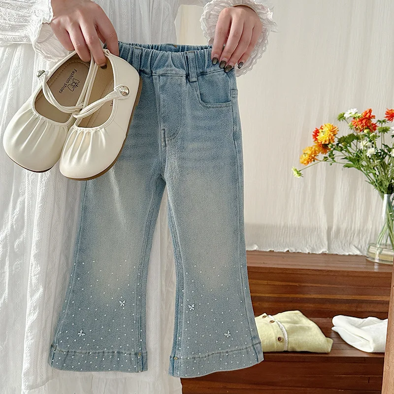 

Girls' spring and summer Korean 2025 elastic horn hot stamping jeans slim fit and stylish pants for children's summer wear