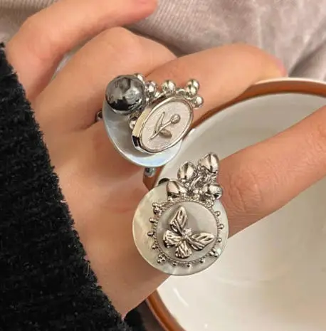 

Original antique style button and seashell handmade beaded ring for women, retro minimalist style, elastic cord adjustable ring.