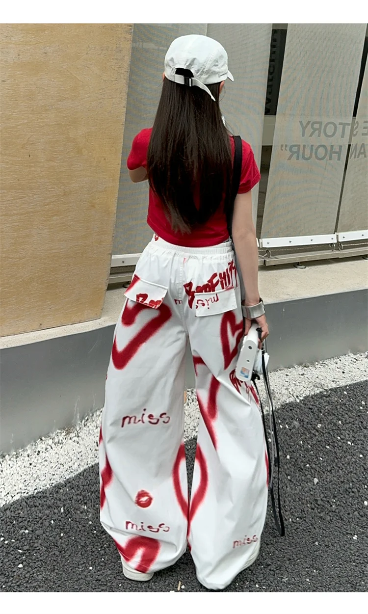 Kinder Hip-Hop Modehose mit Kordelzug und Zeichnungen für Teenager-Mädchen Coole Y2K Streetwear-Hose mit Herz-Graffiti 5-14 Jahre – Detail 5