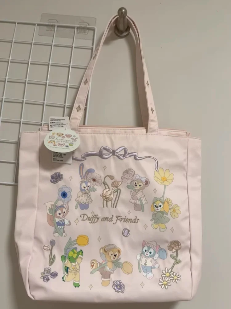กระเป๋าโท้ตดัฟฟี่ดั๊กและผองเพื่อน ฤดูใบไม้ผลิ 2024 ของเซี่ยงไฮ้ดิสนีย์แลนด์ กระเป๋าถือความจุขนาดใหญ่ ของขวัญวันเกิดสำหรับเด็กผู้หญิง ของที่ระลึก