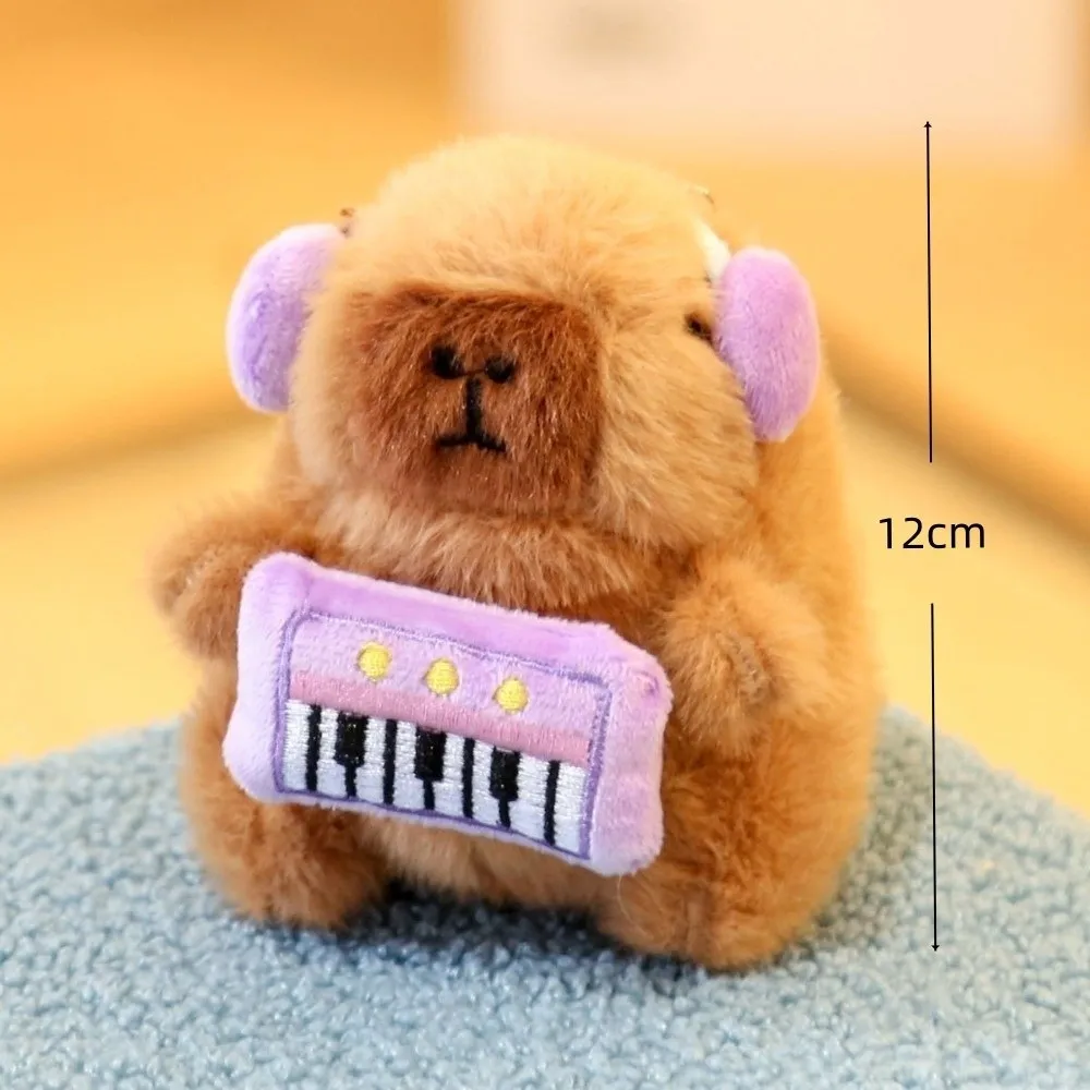 Capivara macio brinquedo de pelúcia boneca com instrumentos tamanho pequeno chaveiro de pelúcia tema festa animais bonitos saco pingente presente das crianças