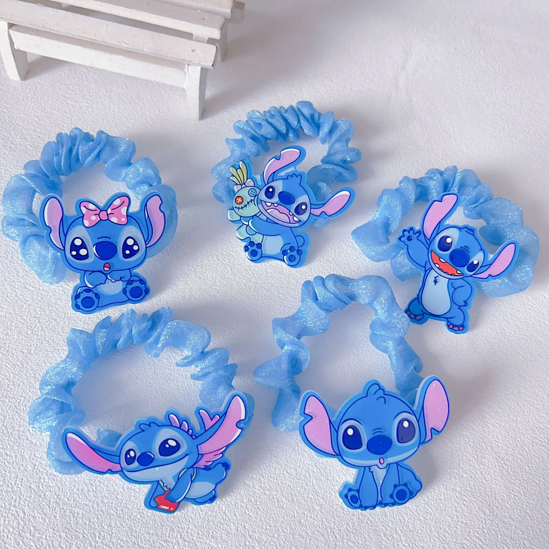 1 piece of pink and blue hair ties featuring Disney's Stitch and Angel. Cute and stylish, it is the perfect gift for friends