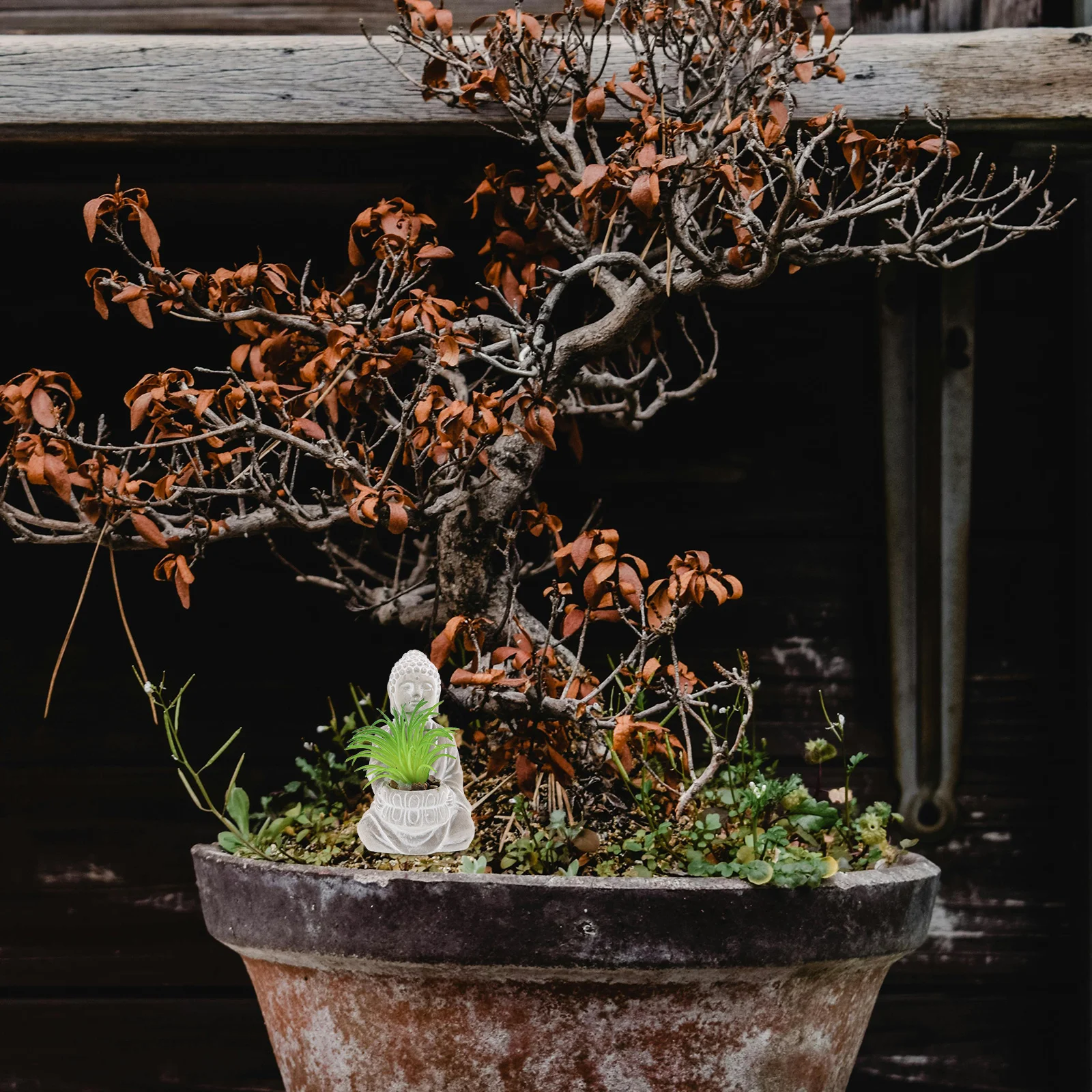 

Small Cement Buddha with Artificial Plants Outdoor Garden Statue for Tranquil Patio Decoration Eastern Culture Inspired