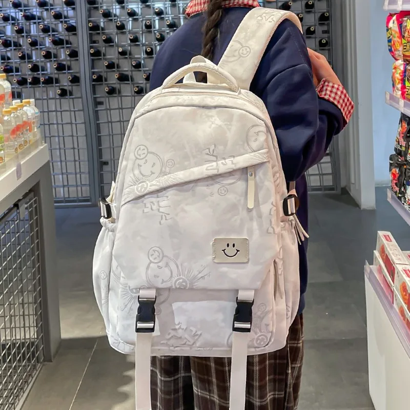 zaino-scolastico-traveasy-2026-nuovo-per-ragazze-in-tessuto-oxford-con-motivo-goffrato-e-distintivo-sorriso-casual-per-campus