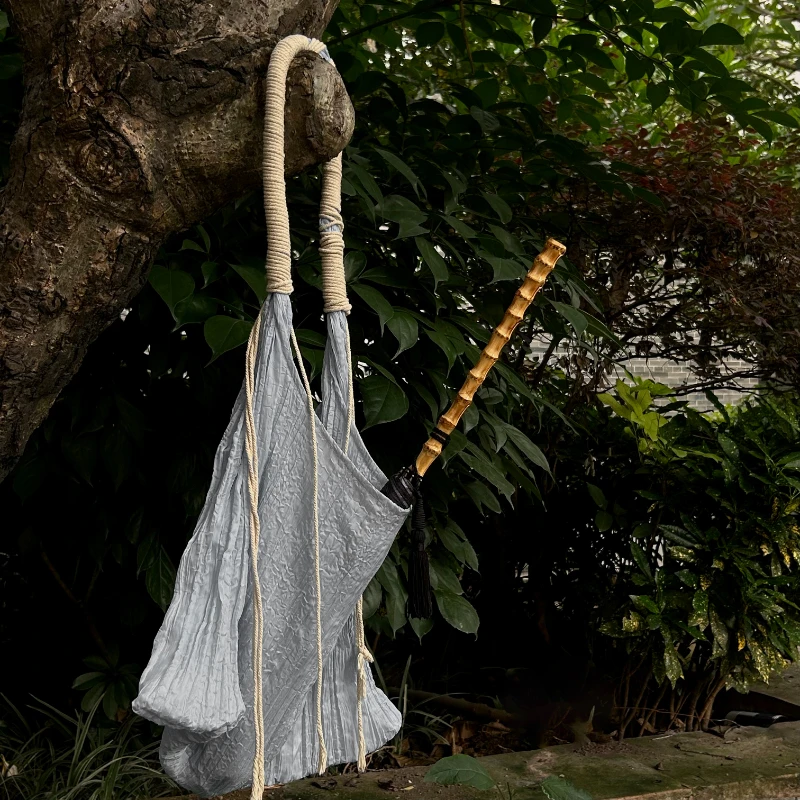 

An orange small bamboo handle umbrella with a long handle, Japanese style, minimalist wind, high aesthetic value