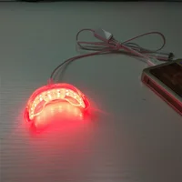 Terapia de luz roja para un alivio inmediatamente del dolor en los dientes, sensibilidad en las encías