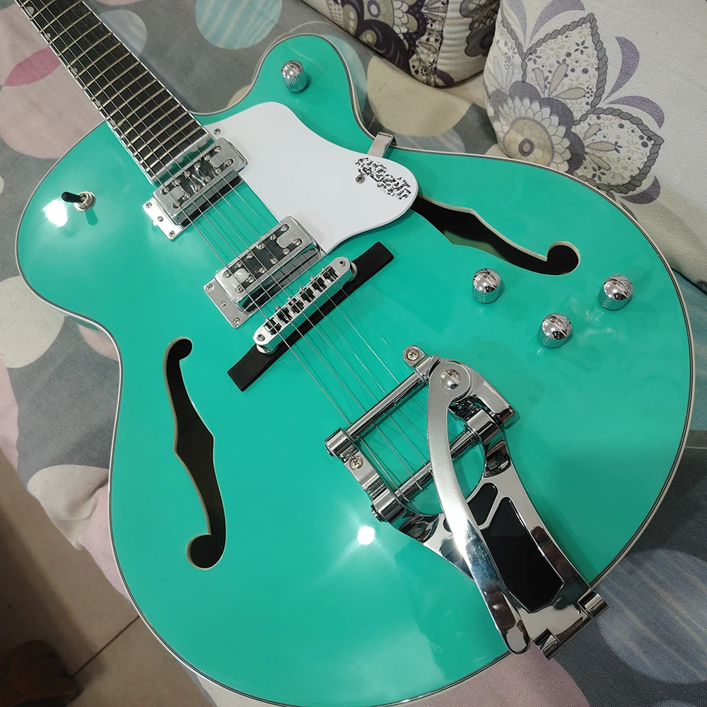 High quality mint green electric guitar, dual f-holes, large vibrato system, in stock and fast shipping