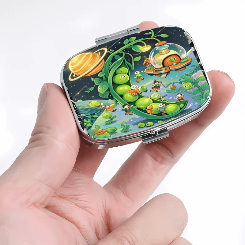 A Metal Flip-Top Pill Box with a Cosmic Pea Party Design, Featuring 2 or 3 Compartments. This Mini Portable Box Is Multifunctional and Suitable for Storing Jewelry.