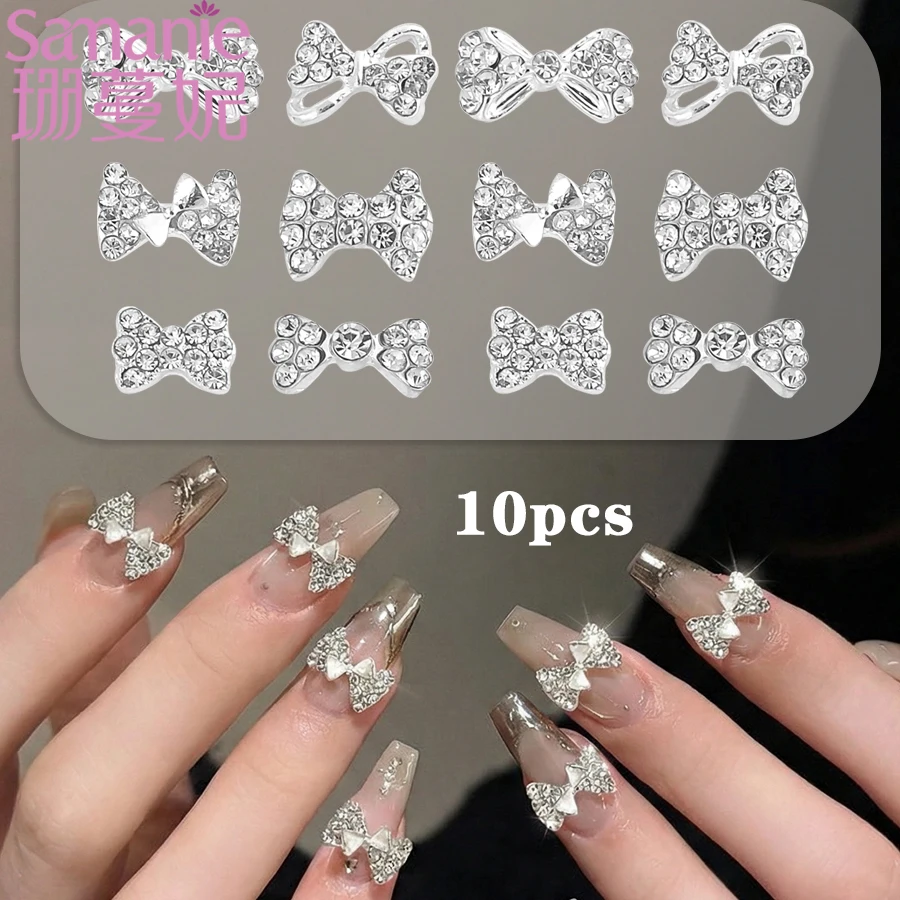 SANANIE 10PCS Shiny White Rhinestone Bow Nail Art Charms 3D Classic Sliver Alloy Butterfly Nails Decoration Manicure Supplies