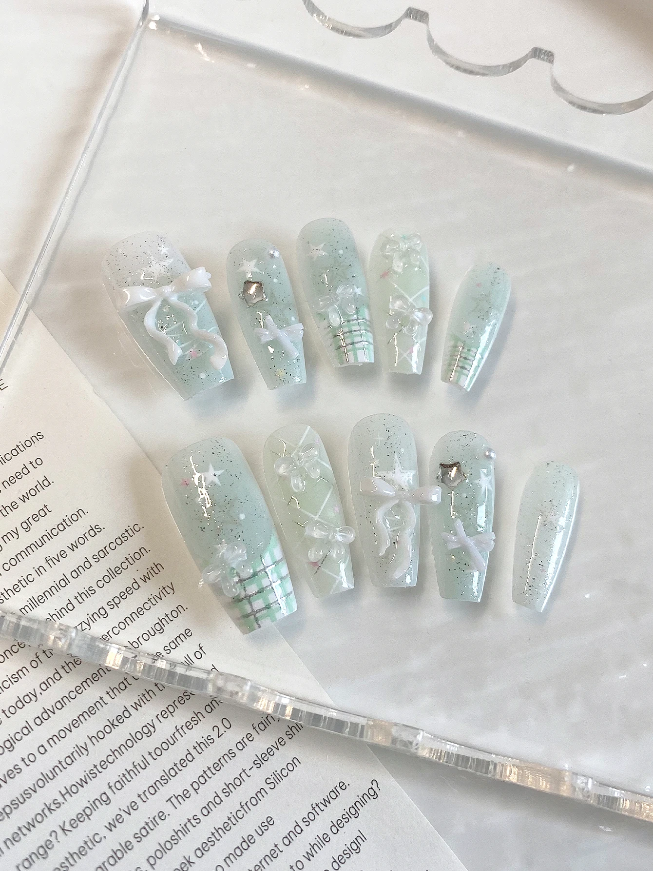 10-Piece Set of Mint Green Plaid Bow Glitter Press-On Nails, with a Clean, Long Trapezoidal Shape That Elongates the Finger Lines, Narrows the Width of the Fingertips, and Enhances Short, Thick Nails. Perfect for Campus Style, Jk Outfits, Summer Picnics, and Girl Photoshoots.