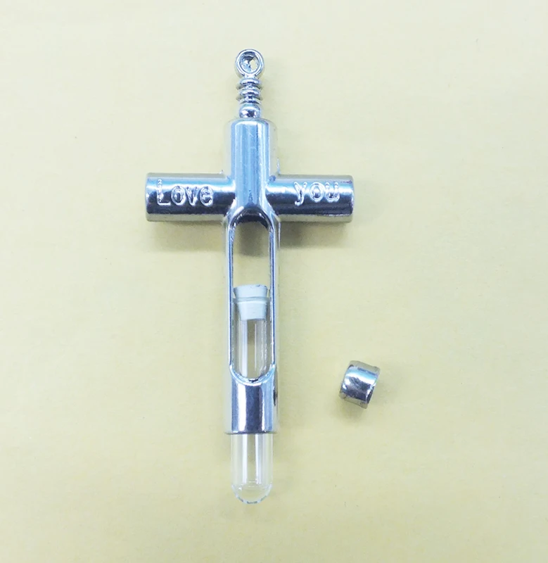 

Factory wholesale, 100PCS, latest design, best-selling! Couple cross perfume bottle pendant