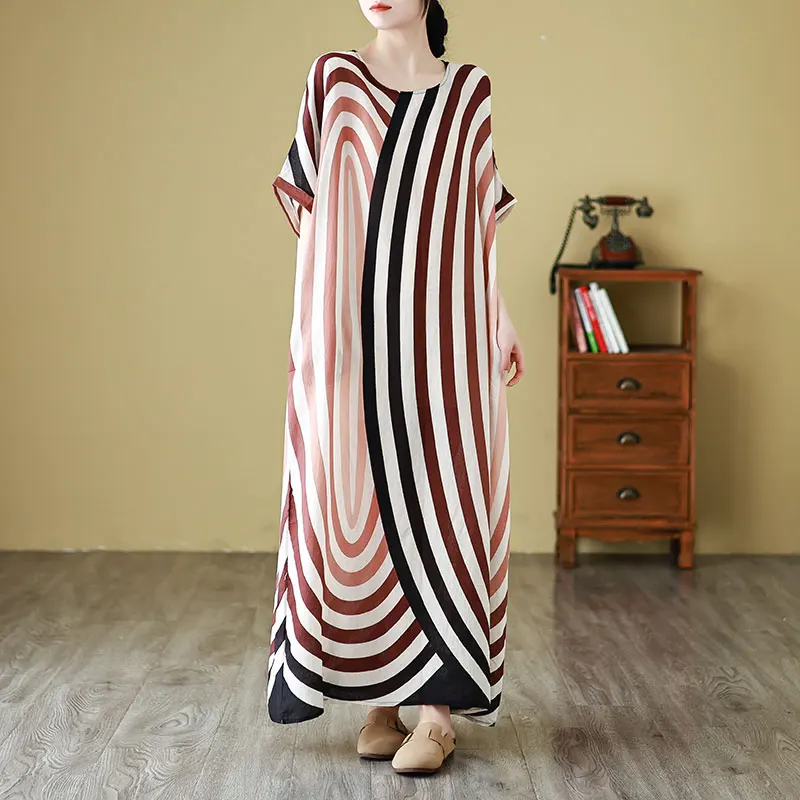 تنورة شاطئ طويلة فضفاضة للصيف والجولة من حرير Ne Yangyun مقاس كبير للنساء رداء دكتور فني للعطلات على الشاطئ