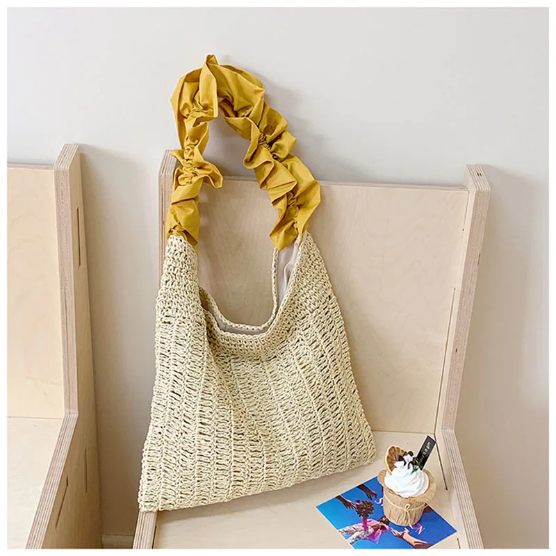 New Pleated Hand-held Commuter Women's Hollow Beach Woven Bag Vacation Niche Shoulder Bag Leisure Style Straw Bag