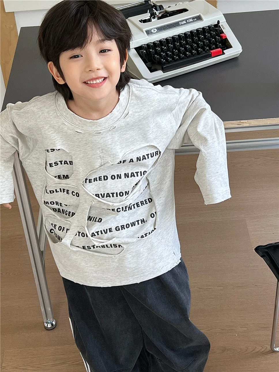 

2025 Autumn Children's Clothing Design Double layered Perforated Long sleeved Letter Boys' Stylish Interior Top