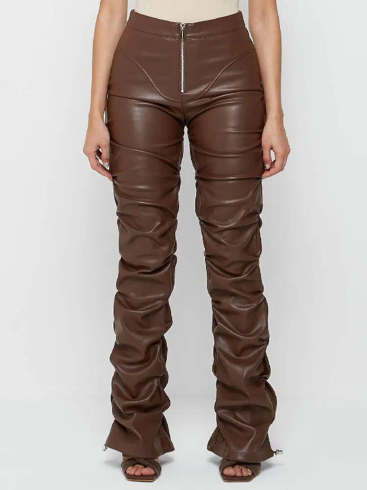 Stylish, tight-fitting PU leather trousers with a unique flared design and pleats.