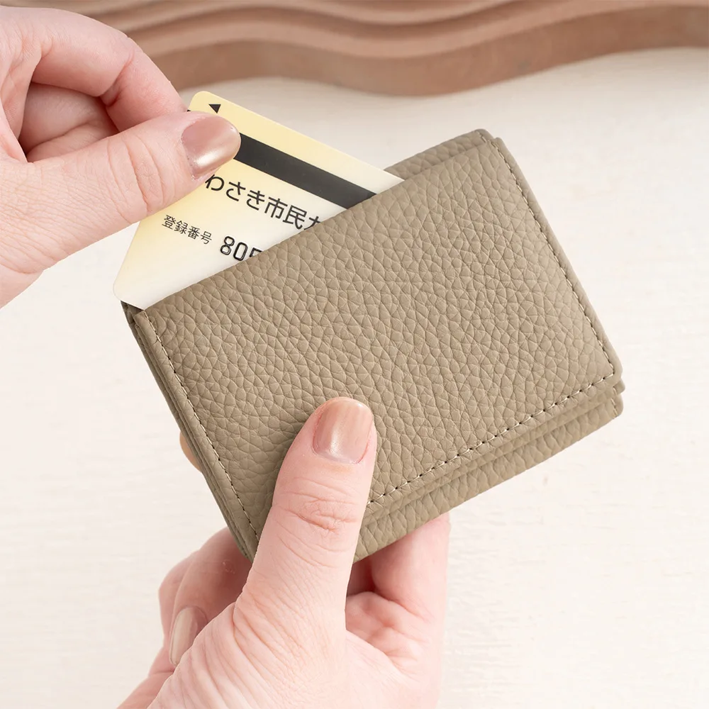 Alirattan 2026 New Genuine Leather Lychee Pattern Three Fold Women's Short Wallet Loose Change Anti-Theft Brush