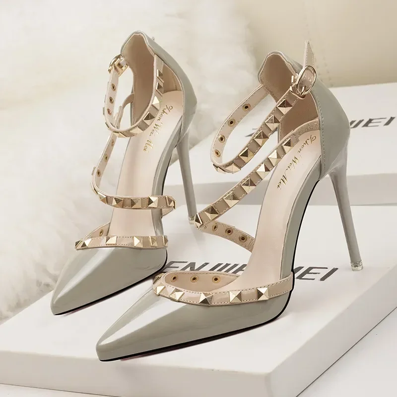 

Sexy Nightclubs with Thin 10CM Heel High Heel Shallow Pointed Head Rivet Hollow Word Belt PUMPS Simple Women's Shoes