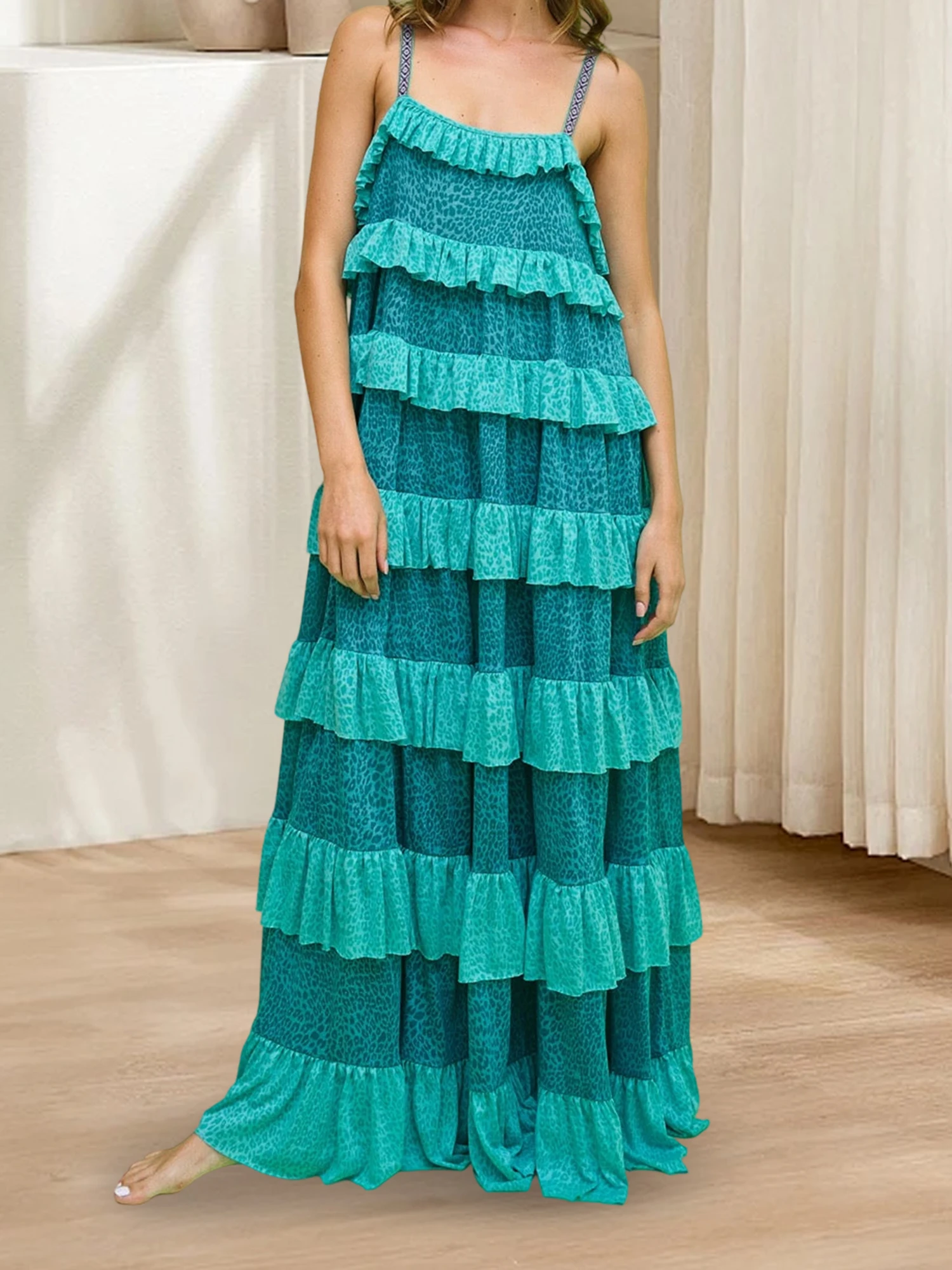 Vestido maxi elegante sem mangas com decote em V e babados fluidos em camadas, perfeito para festas e eventos de verão