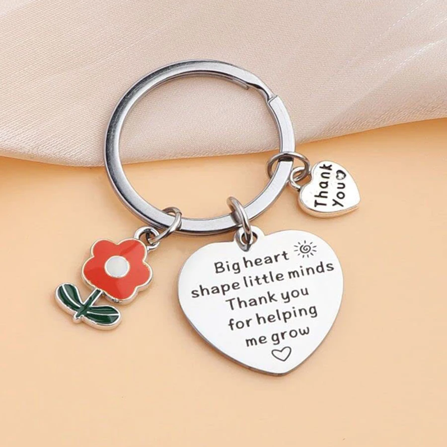The new Teacher\'s Day gift is a flower pendant with a caring stainless steel keychain. Thank you, teacher