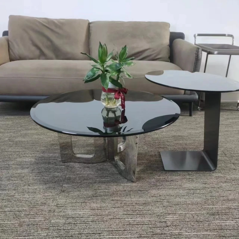 

Italian minimalist light luxury tempered glass coffee table designer small apartment household round creative stainless steel