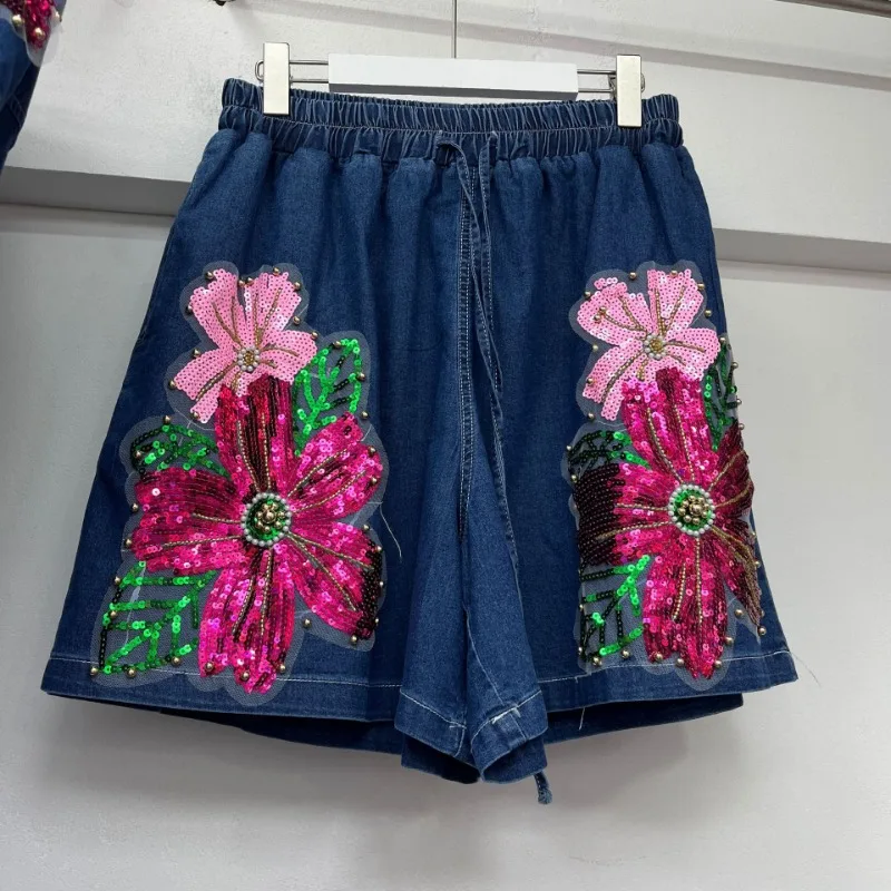 ユニークなデザインの女性のルーズ半袖シャツ新しい夏ヨーロッパ重工業ファッションワイドレッグショーツデニムジャケット 2 個セット