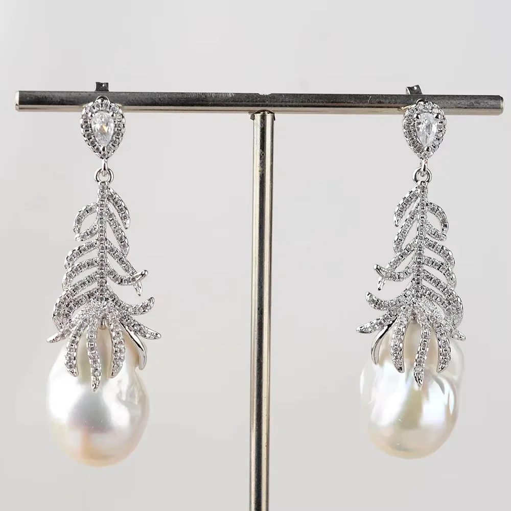 

Natural Cultured White Baroque Pearl White Golden Plated Feather Earrings