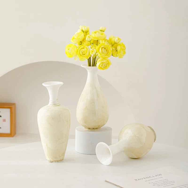 

Ceramic vase with crystalline glaze, white decorative piece, for use in living room flower arrangement, exuding a luxurious.