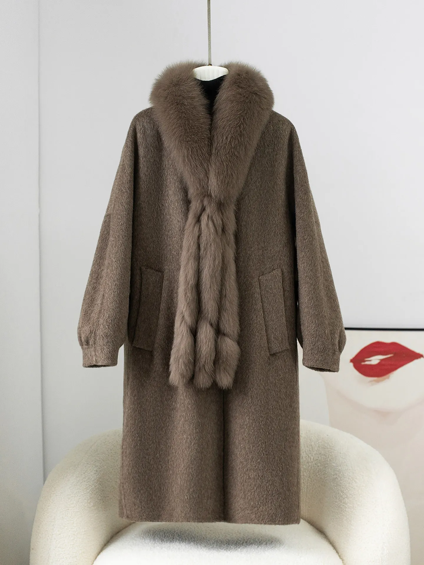 A mid-length, elegant women's woolen coat with a detachable double-sided cashmere inner liner and fox fur scarf