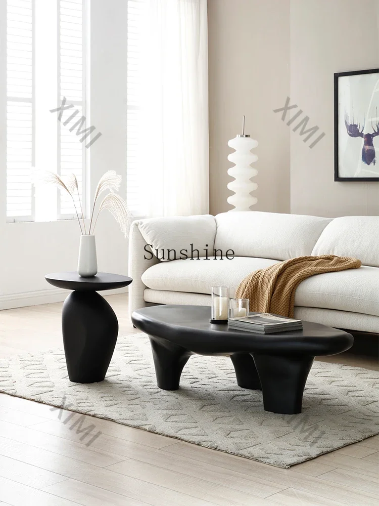 Minimalist sofa corner few black pebble small coffee table