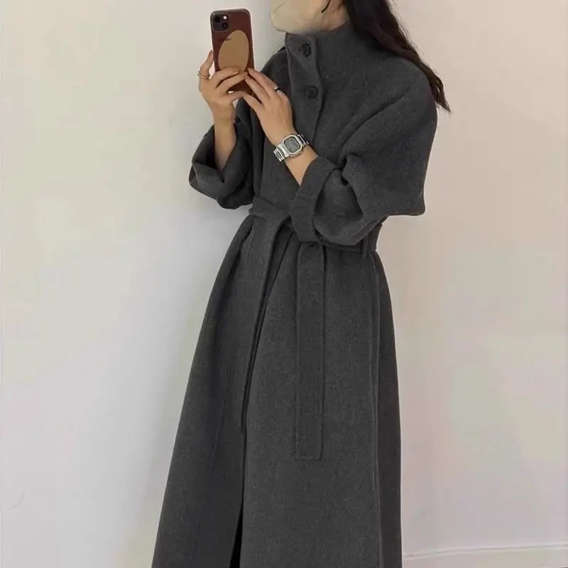 

2025 женское шерстяное пальто, длинный свободный плащ, модная верхняя одежда в корейском стиле, теплая зимняя куртка с поясом