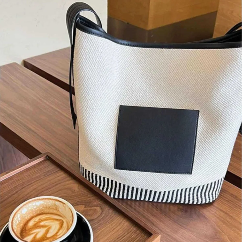 Bolso tipo cubo de lona a rayas, bolsos cruzados de retales para mujer, novedad de 2025, bolsos grandes de compras para ir al trabajo, bolso de hombro de diseñador elegante