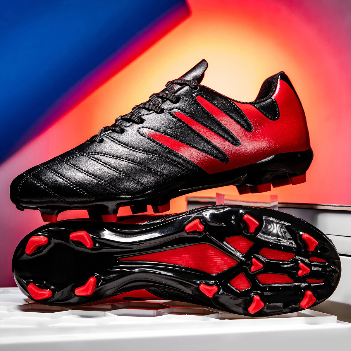 

New football shoes with TF studs for turf and FG long studs,designed in a low-top style suitable for both men and women training