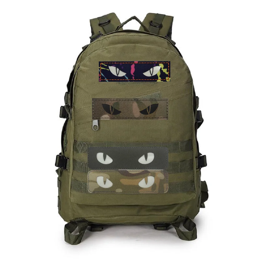 Outdoor Glow-in-the-dark Demon Eyes Badge Cat Eye Morale Tactical Creative Cat Eye Clasp Backpack Hat Outdoor MOLLE Pendant