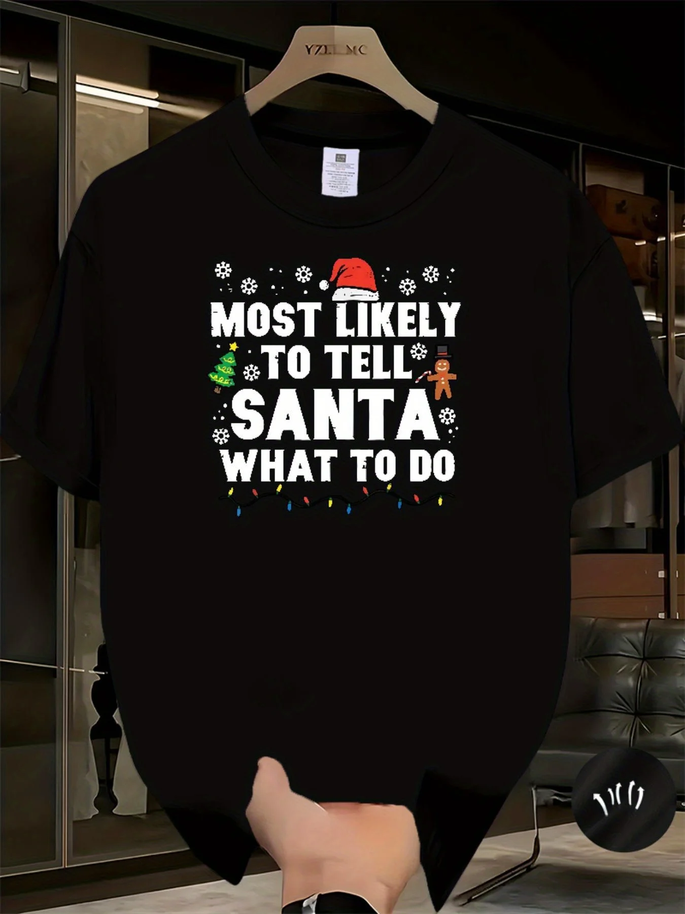 

Funny Santa Claus Humorous Men's T-shirt - "Most likely to tell Santa Claus what to do" slogan, snowflake and reindeer pattern