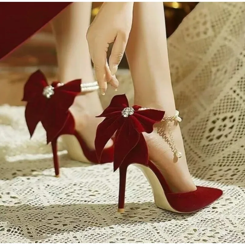 

Red Xiuhe Wedding Shoes New Pointy Stiletto High Heels Female Shallow Mouth Bow Pearl One Word Buckle Strap Two Wear Bride Shoes