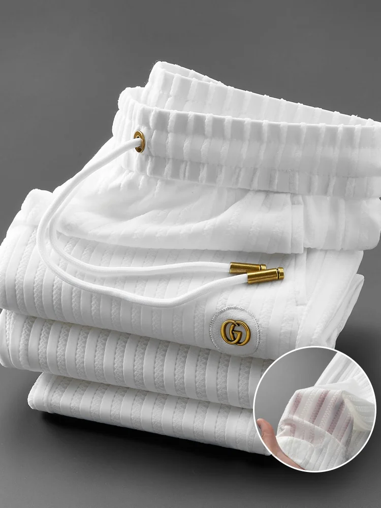 

Легкие дышащие белые мужские спортивные брюки премиум-класса с вышивкой, приталенные, с манжетами, для лета