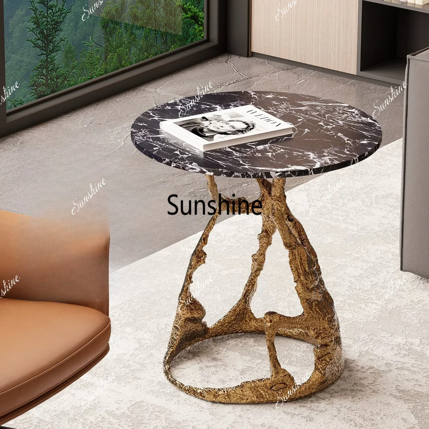A few high-end round tables next to the light luxury imitation brass sofa, high-end artworksTJ
