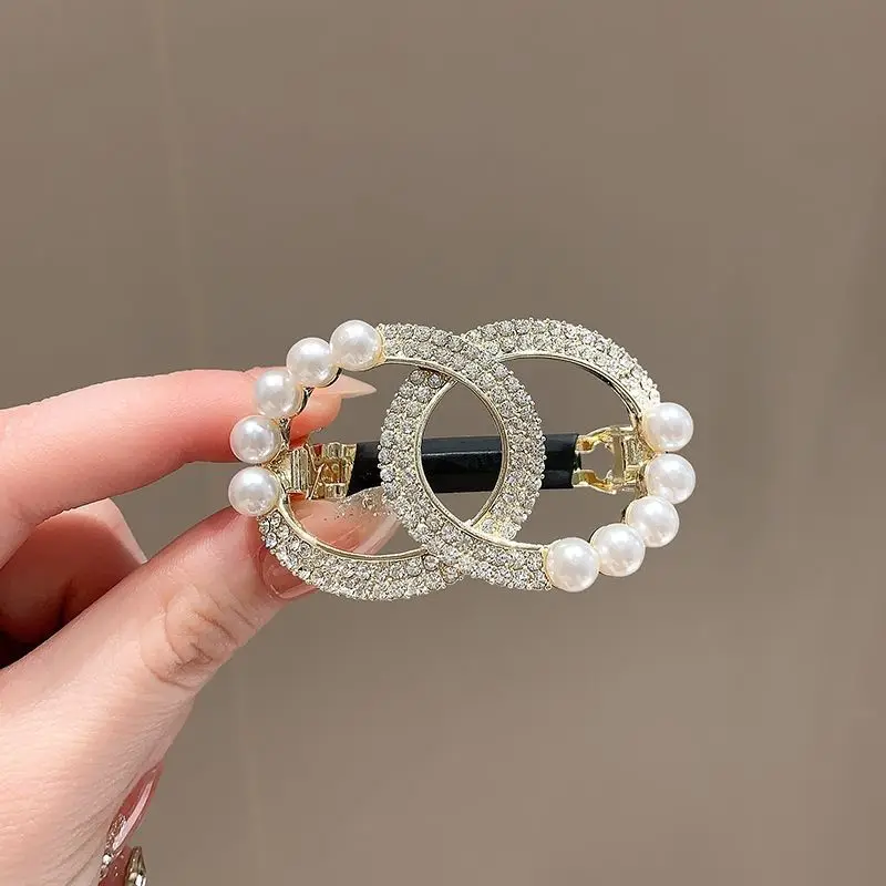 

2026 new light luxury high-end round ring hair clip hollow temperament luxurious feeling sweet pearl spring clip hair accessory