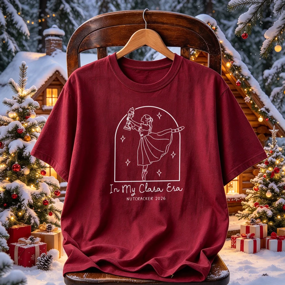 In My Clara Era Nutcracker 2026 Line Art Ballerina Clara Holding Nutcracker Star Arch Frame Print Ballet Christmas Casual Tops