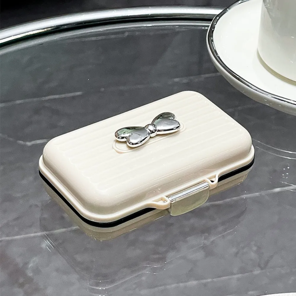 

Portable Travel Pill Organizer Fashion Bow Pill Box 7 Compartments Moisture-proof Pill Dispenser Travel Essentials