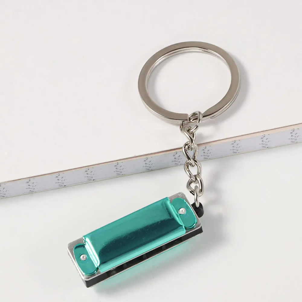 * 0.8 سنتيمتر حقيبة قلادة الآلات الموسيقية على شكل هدايا لتعليق المساعدة هارمونيكا المفاتيح مفاتيح حامل كيرينغ التوافقي